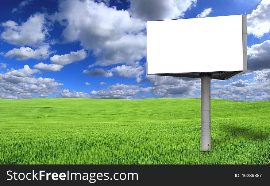 Isolated big blank street billboard in field. Isolated big blank street billboard in field