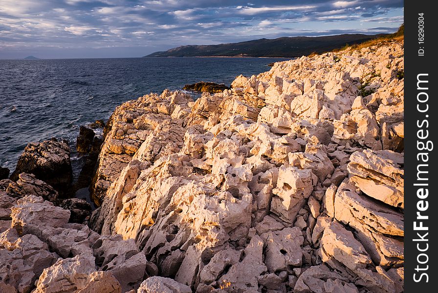 Sea stone coast in morning light. Sea stone coast in morning light