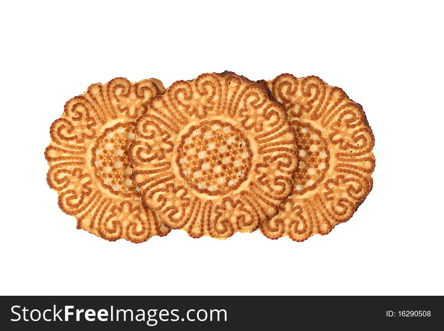 Three round cookies with a pattern. Isolated on white background.