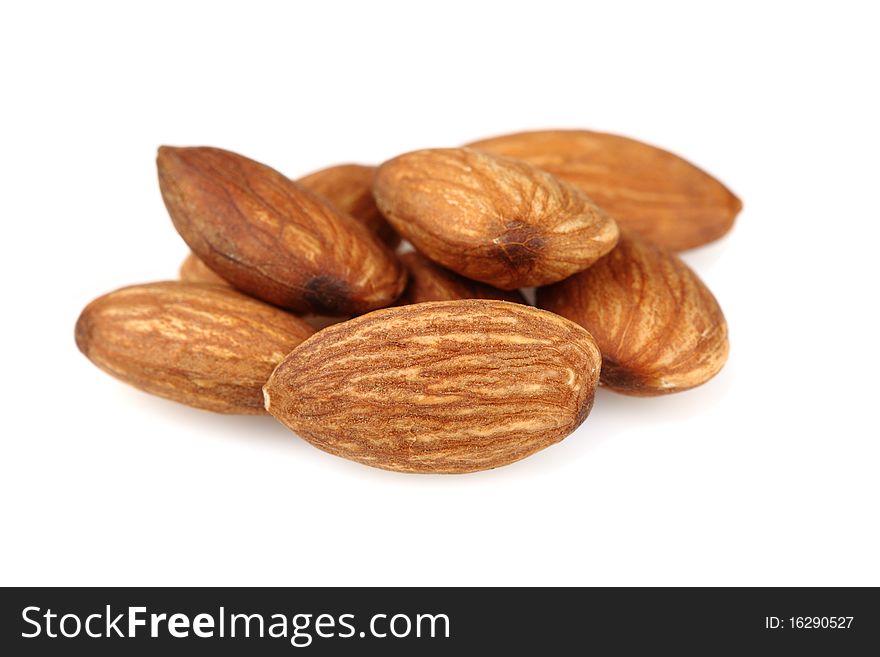 A few almonds. Isolated on white background.