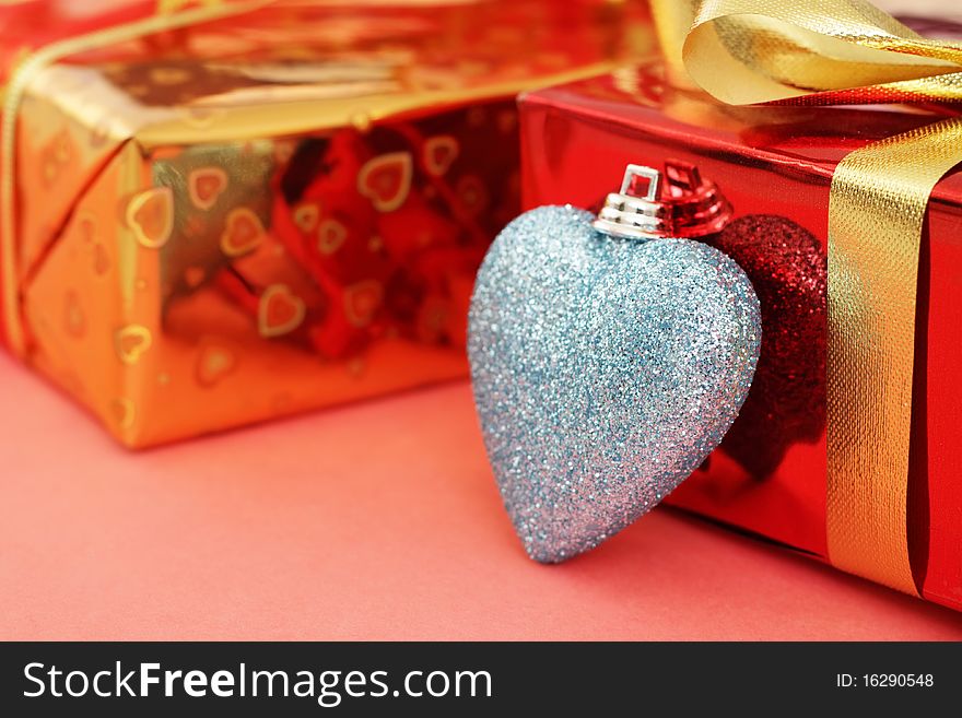 Several colored gift boxes and decorative heart