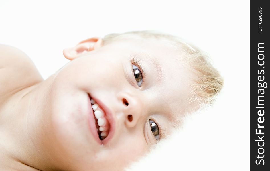 The smiling child on a white background. The smiling child on a white background