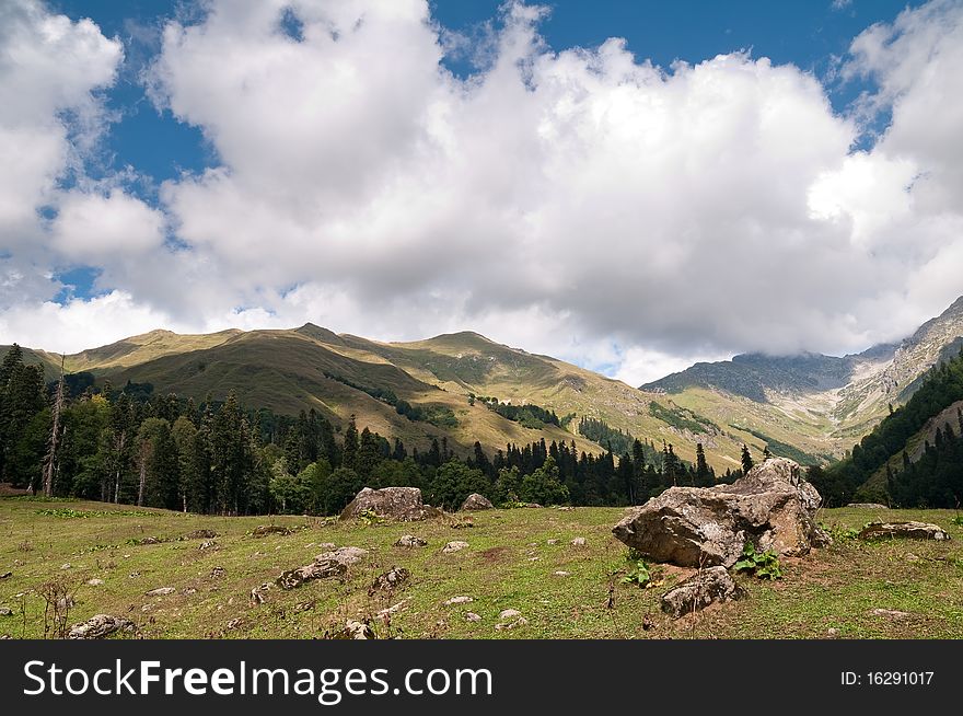 Picturesque valleys above lake Ritsa involve with the beauty and mineral sources of many tourists.Abkhazia. Picturesque valleys above lake Ritsa involve with the beauty and mineral sources of many tourists.Abkhazia.