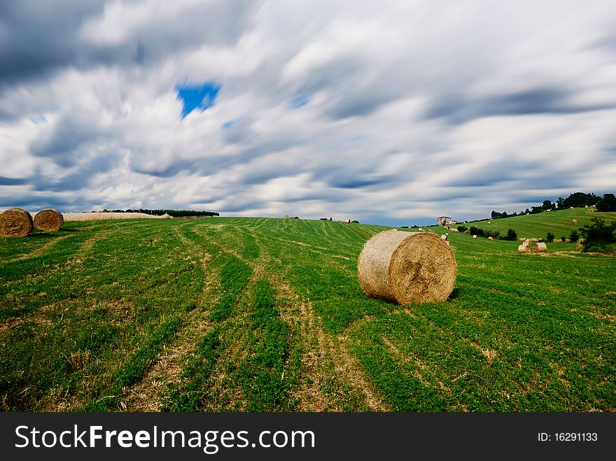 Countryside With Bales Of Hay