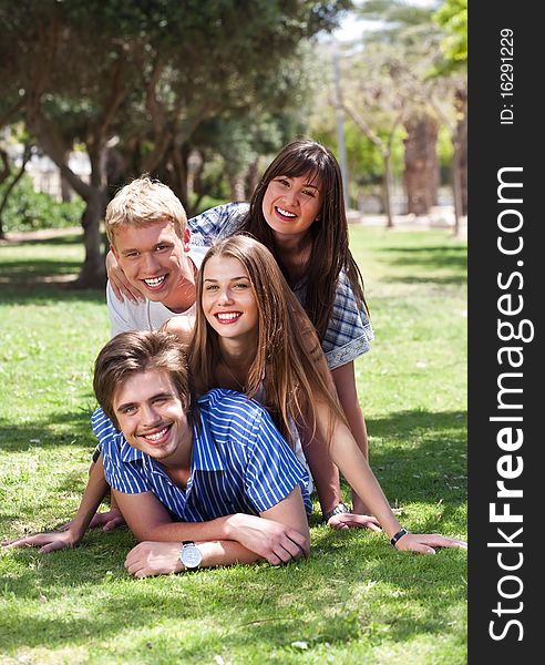 Beautiful group of friends at the park having fun during summer vacations