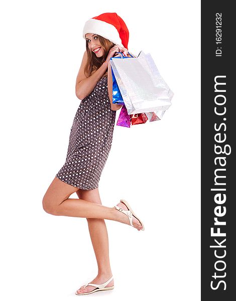 Beautiful teenager carrying shopping bags isolated on white background. Beautiful teenager carrying shopping bags isolated on white background