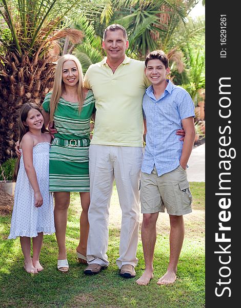 Portrait of happy family, outdoors