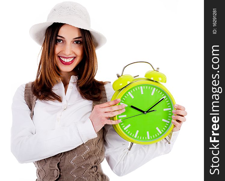 Portrait of stylish lady holding alarm clock on an isolated background