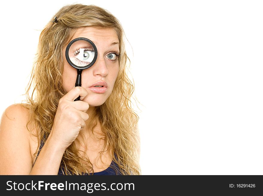 Young woman looking through a magnifying glass. Isolated on white background. Young woman looking through a magnifying glass. Isolated on white background