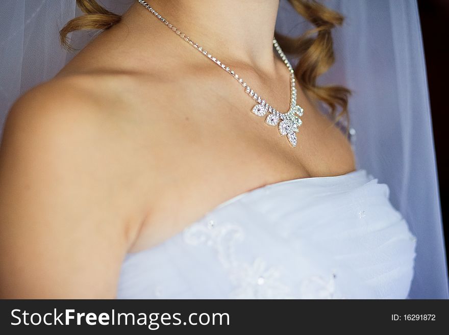Adornment On Neck Of Young Bride