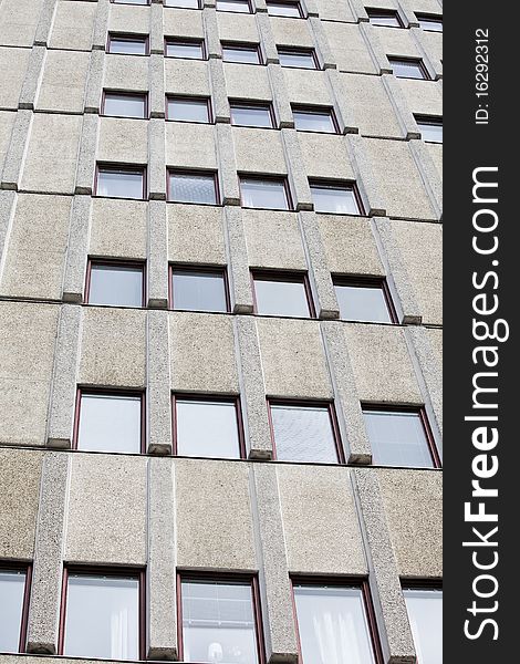 Several windows on a worn building