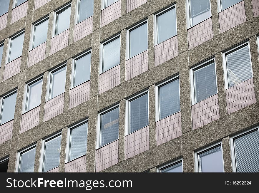 Several windows on a worn Building