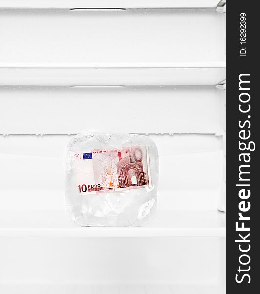 Frozen Euro Bank-note in a fridge. Frozen Euro Bank-note in a fridge