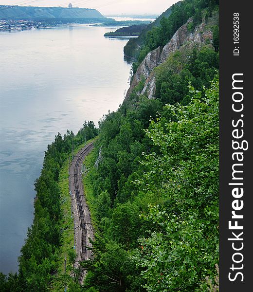 Railway runs along the river, view from above