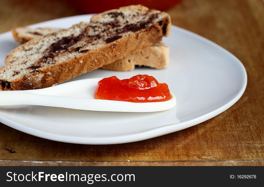 Delicious tomato jam with cinnamon with chocolate biscotti
