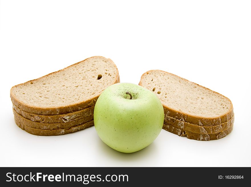 Cut bread with green apple. Cut bread with green apple