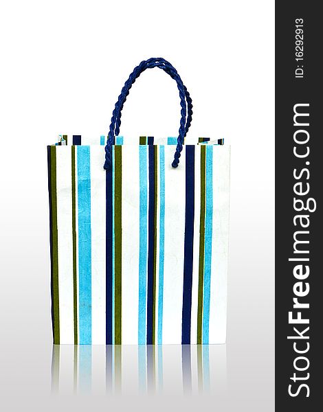 Paper stripes blue white bag on white background at has the shade. Paper stripes blue white bag on white background at has the shade