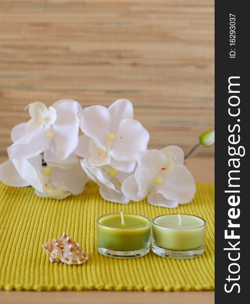 Essential  candle and flower in health spa for spa treatment.