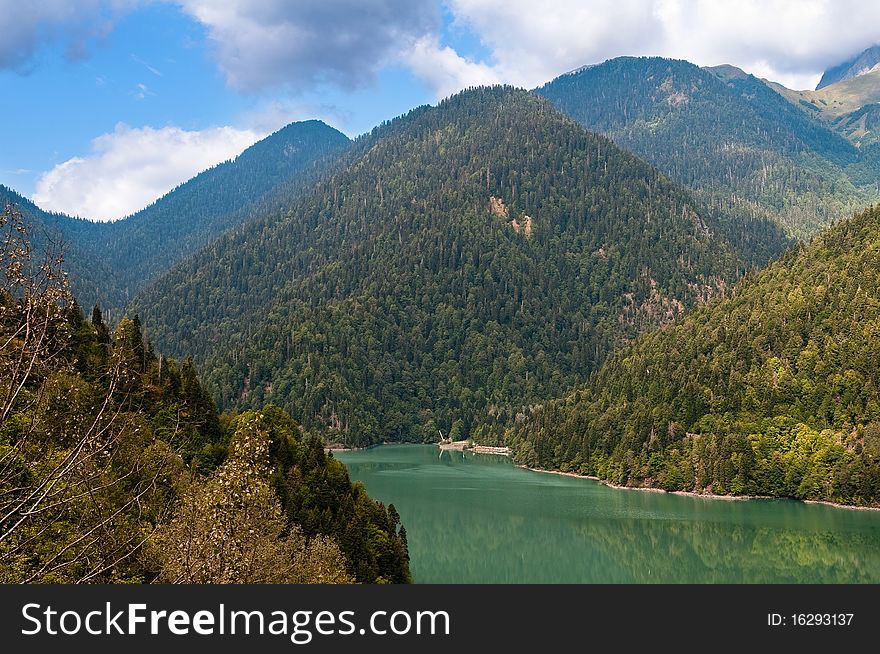 Lake Ritsa - one of the most beautiful lakes in the Caucasian mountains. The main tourist object of Abkhazia - national park, reserve. Lake Ritsa - one of the most beautiful lakes in the Caucasian mountains. The main tourist object of Abkhazia - national park, reserve.