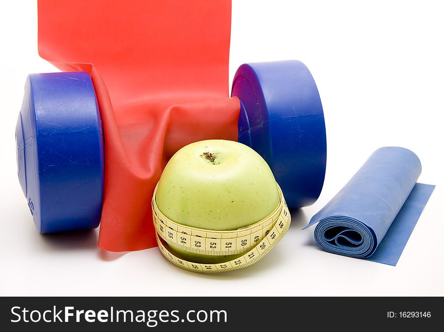 Fitness rubber and blue dumbbell. Fitness rubber and blue dumbbell