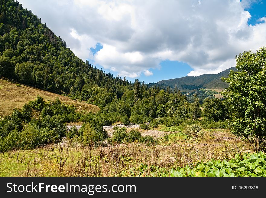 Picturesque valleys above lake Ritsa involve with the beauty and mineral sources of many tourists.Abkhazia. Picturesque valleys above lake Ritsa involve with the beauty and mineral sources of many tourists.Abkhazia.