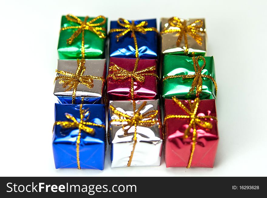 Many colorful gift boxes on a white background