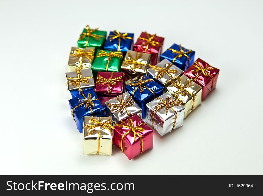 Many colorful gift boxes on a white background