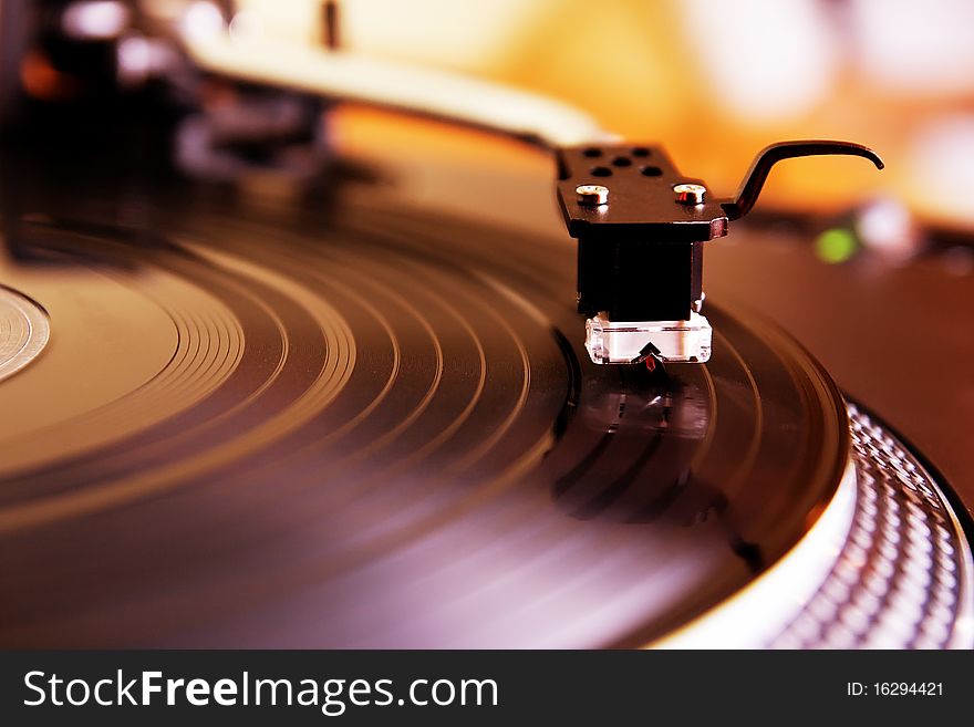 Record player spinning the disc with music. Record player spinning the disc with music