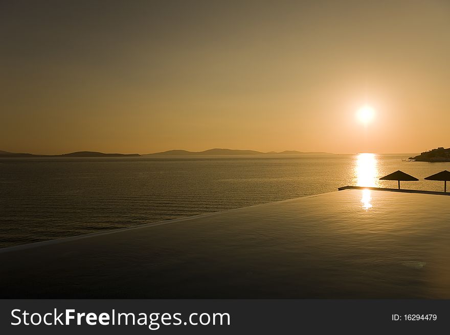 Sunset over port of Mykonos, Greece