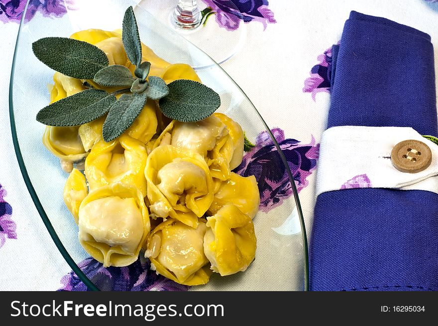 A plate of tortellini with sage butter. A plate of tortellini with sage butter