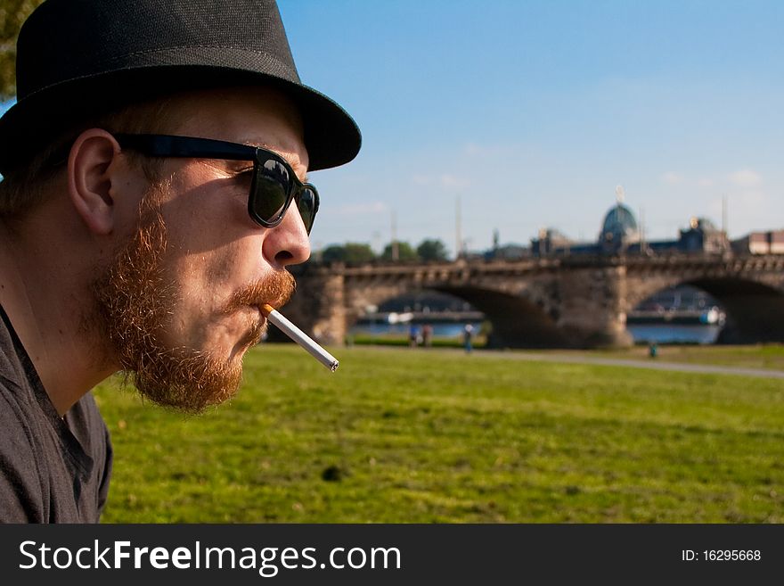 Profile man with a cigarette in dresden