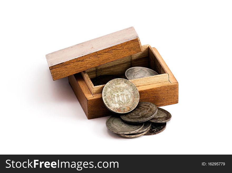 Old hungarian silver coins in a wooden box. The coins were made in 1947, with Kossuths face and the hungarian coat of arms on them.