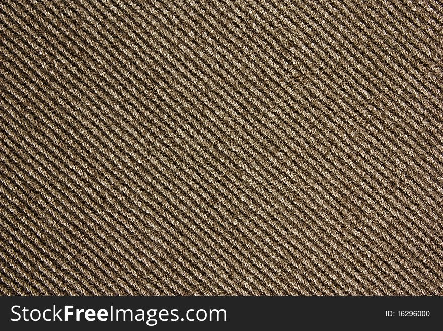 Closeup of brownish jeans fabric. Closeup of brownish jeans fabric.