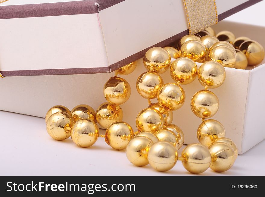 Golden balls in a white gift box