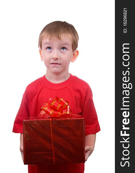 Happy boy thinks about the gift, isolated on a white background