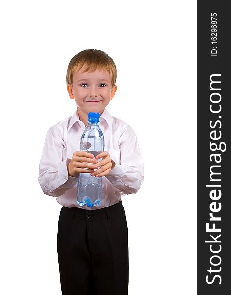 Happy boy with a bottle of water on a white background