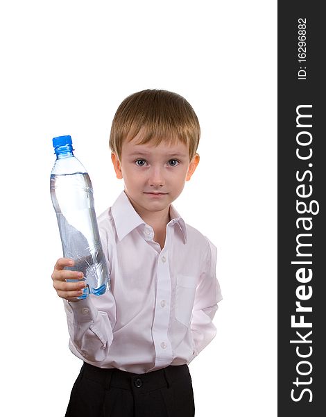 Happy boy with a bottle of water on a white background