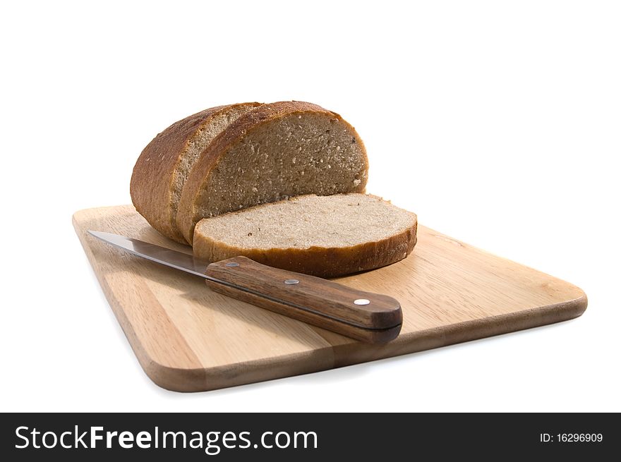 Slices of bread on a breadboard, isolated. Slices of bread on a breadboard, isolated