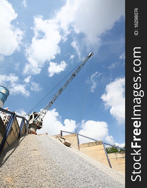 The big crane in cement factory with nice sky. The big crane in cement factory with nice sky.