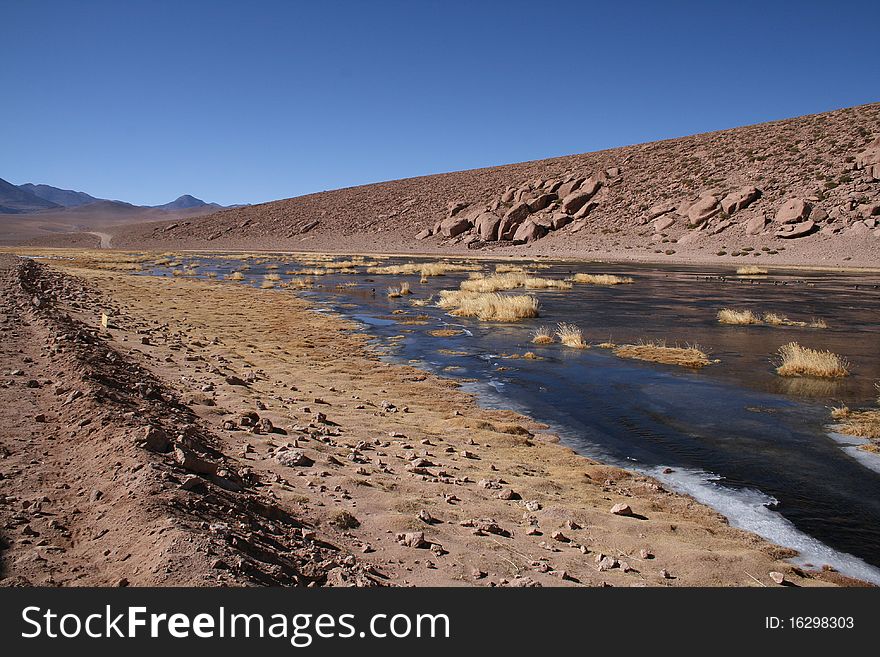 The River of San Pedro, crossing the desert of Atacama, with ice formation over it, and the Licancabur Vulcan at back. The River of San Pedro, crossing the desert of Atacama, with ice formation over it, and the Licancabur Vulcan at back.