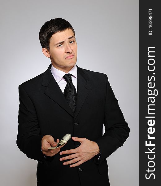 Expressions.Young handsome business man with money