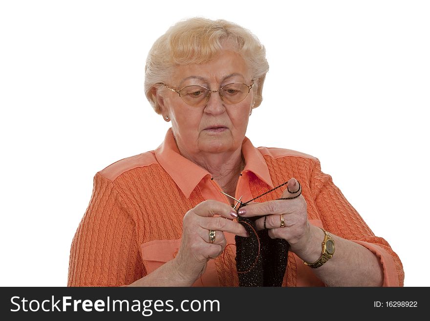 Old woman senior is knitting-isolated on white background