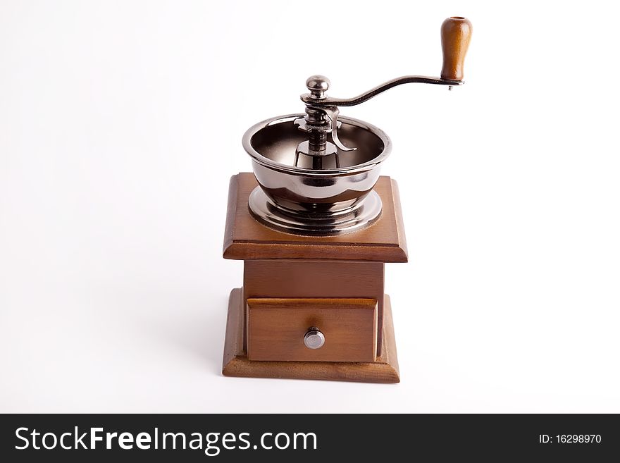 Vintage coffee mill isolated at white background. Studio shot.