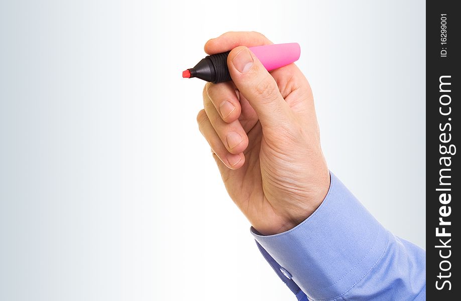 Hand with marker on a gray background