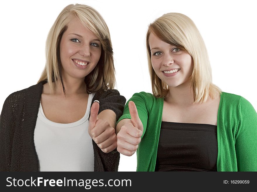 Two young caucasian girlfriends having fun together  isolated over white background. Two young caucasian girlfriends having fun together  isolated over white background