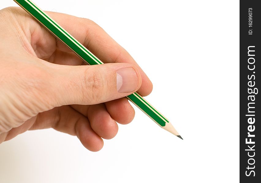 Hand holding a pencil on a white. Hand holding a pencil on a white