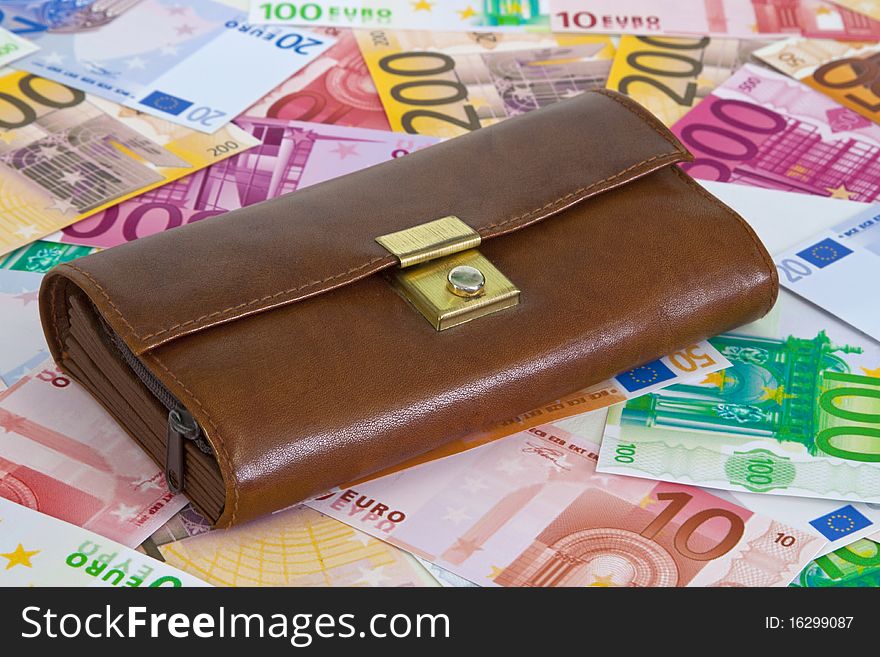 Purse with euro banknotes as background. Purse with euro banknotes as background