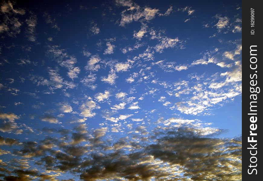 Blue Sky With Black And White Clouds