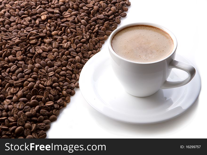 Coffee cup and grain on white background