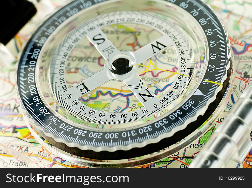 Compass on the map background. Compass on the map background
